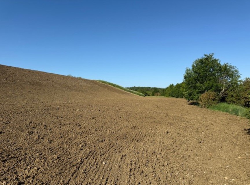 Photos of exposed structural clay following removal of slipped topsoil, and of completed works - supporting image